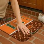 miami-hurricanes-chevron-stack-orange-doormat-best-selling.webp