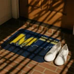 michigan-wolverines-tribal-detailing-blue-black-doormat-best-selling.webp