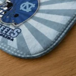 north-carolina-tar-heels-helmet-centerpiece-light-blue-doormat-best-selling.webp