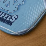north-carolina-tar-heels-silver-halftone-light-blue-doormat-best-selling.webp