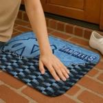 north-carolina-tar-heels-tribal-detailing-light-blue-black-doormat-best-selling.webp