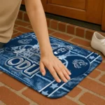 old-dominion-monarchs-helmet-illustration-blue-doormat-best-selling.webp