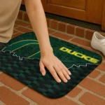 oregon-ducks-tribal-detailing-green-black-doormat-best-selling.webp