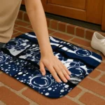 penn-state-nittany-lions-palm-silhouette-blue-black-doormat-best-selling.webp