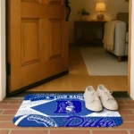 personalized-duke-blue-devils-football-crest-blue-black-doormat-best-selling.webp