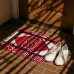 personalized-nc-state-wolfpack-football-crest-red-black-doormat-best-selling.webp