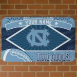 personalized-north-carolina-tar-heels-football-crest-light-blue-black-doormat-best-selling.webp