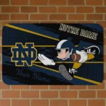 personalized-notre-dame-fighting-irish-mickey-quarterback-navy-black-doormat-best-selling.webp