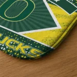 personalized-oregon-ducks-football-crest-green-black-doormat-best-selling.webp