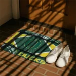 personalized-oregon-ducks-football-crest-green-black-doormat-best-selling.webp