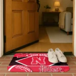 customized-nebraska-cornhuskers-football-crest-red-black-doormat-best-selling.webp