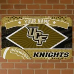 customized-ucf-knights-football-crest-gold-black-doormat-best-selling.webp