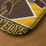 customized-wyoming-cowboys-football-crest-brown-black-doormat-best-selling.webp