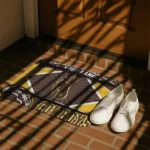 customized-wyoming-cowboys-football-crest-brown-black-doormat-best-selling.webp