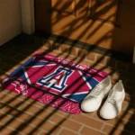 personalized-arizona-wildcats-football-crest-red-black-doormat-best-selling.webp