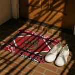 personalized-cornell-big-red-football-crest-red-black-doormat-best-selling.webp