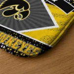 personalized-iowa-hawkeyes-football-crest-black-doormat-best-selling.webp