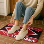 personalized-louisiana-ragin-cajuns-football-crest-red-black-doormat-best-selling.webp