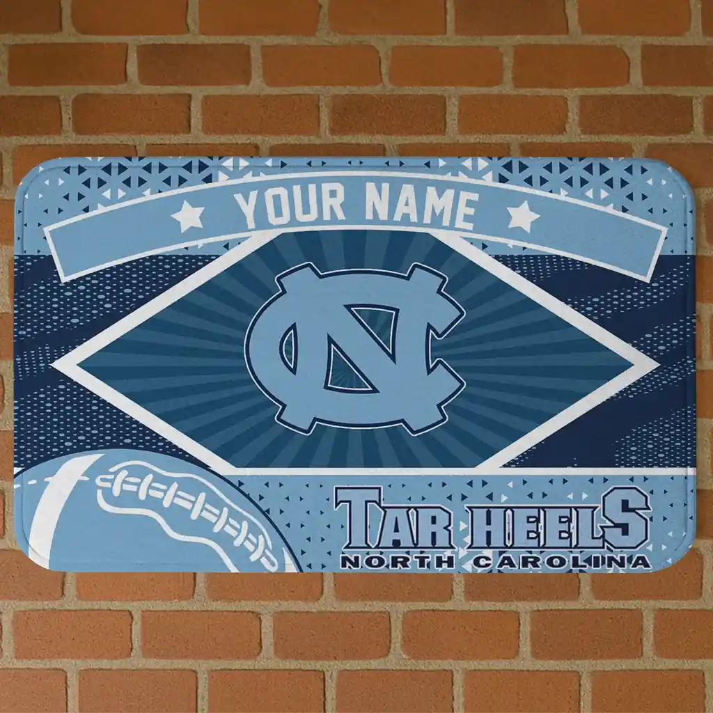 personalized-north-carolina-tar-heels-football-crest-light-blue-black-doormat-best-selling.webp personalized north carolina tar heels football crest light blue black doormat best selling
