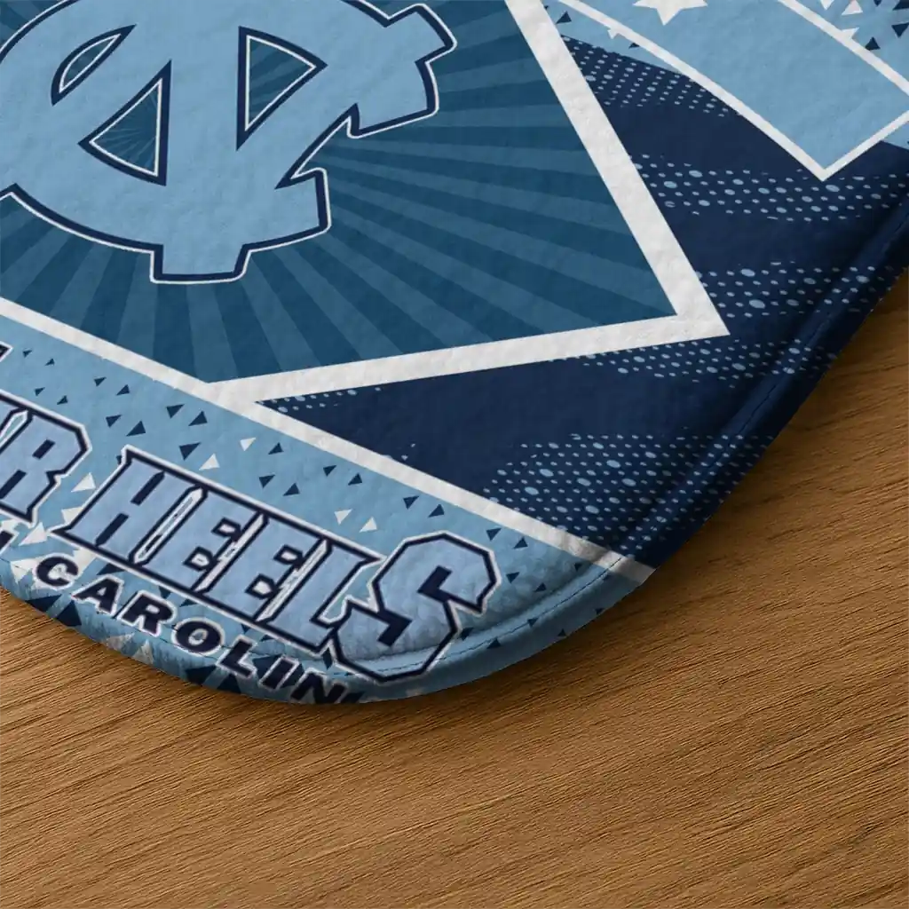 personalized-north-carolina-tar-heels-football-crest-light-blue-black-doormat-latest-model.webp