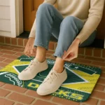 personalized-oregon-ducks-football-crest-green-black-doormat-best-selling.webp