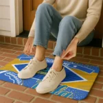 personalized-ucla-bruins-football-crest-blue-black-doormat-best-selling.webp