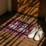 colgate-raiders-helmet-illustration-maroon-doormat-best-selling.webp