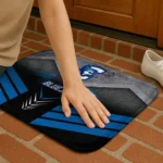 creighton-bluejays-chevron-points-blue-black-doormat-best-selling.webp