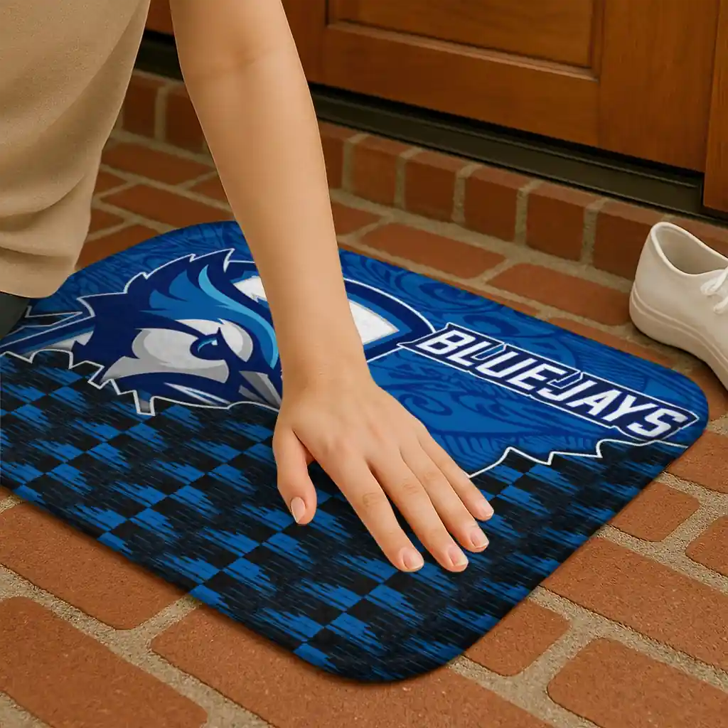 creighton-bluejays-tribal-detailing-blue-black-doormat-premium-grade.webp