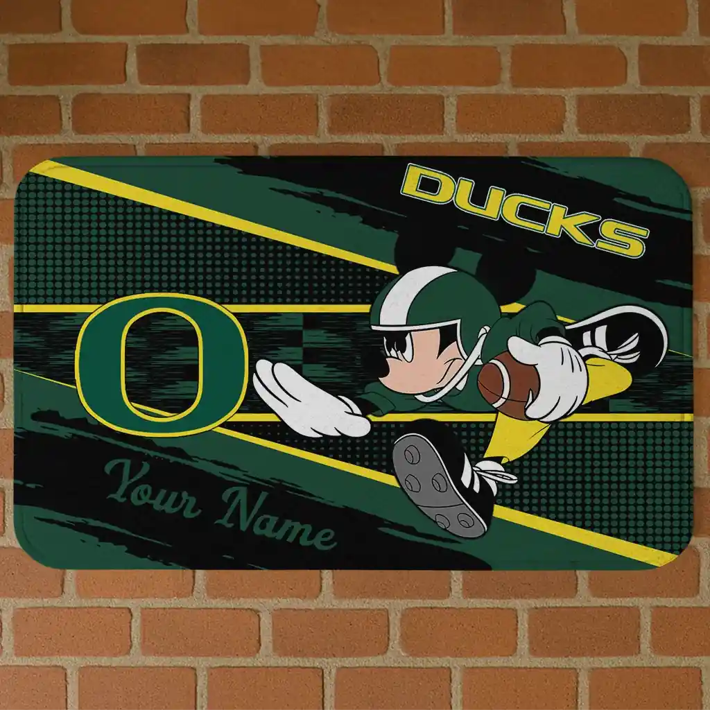 custom-oregon-ducks-mickey-quarterback-green-black-doormat-best-selling.webp custom oregon ducks mickey quarterback green black doormat best selling