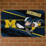 customized-michigan-wolverines-mickey-quarterback-blue-black-doormat-best-selling.webp