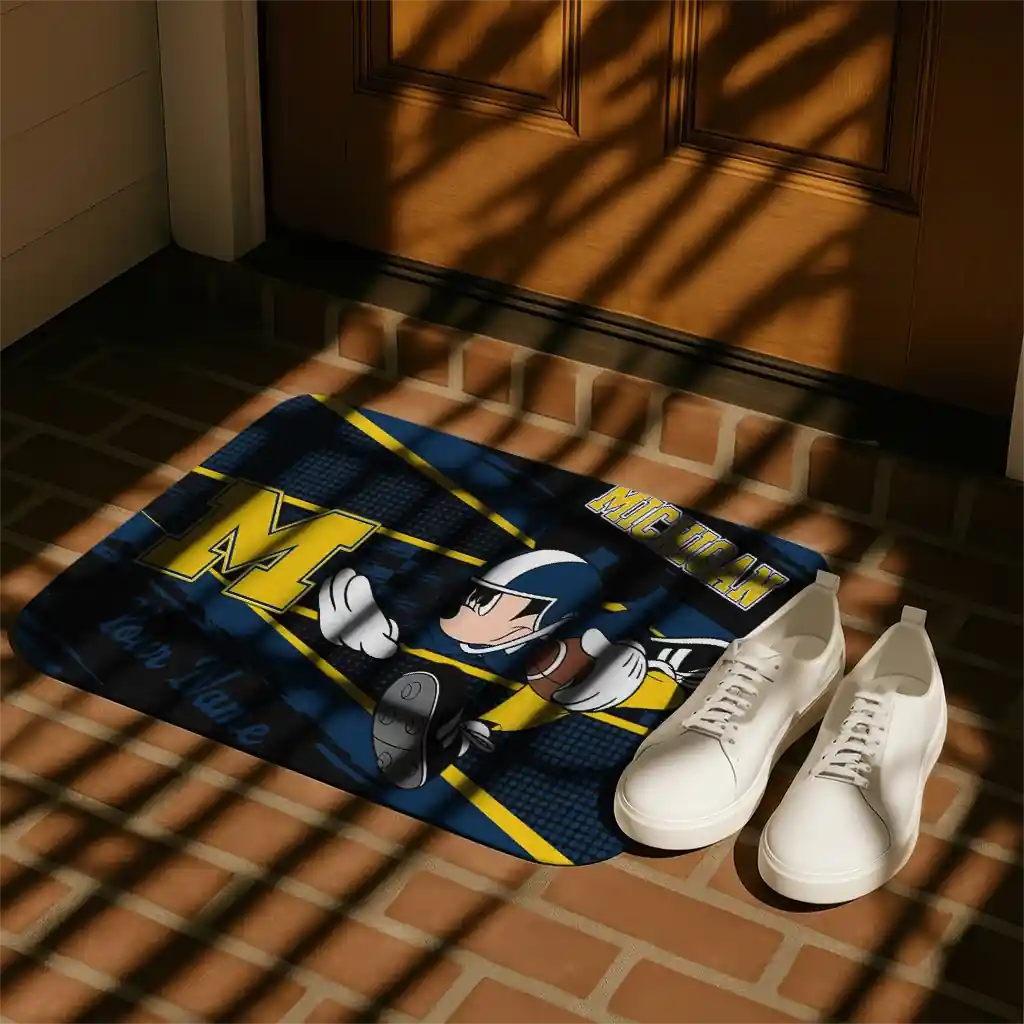 customized-michigan-wolverines-mickey-quarterback-blue-black-doormat-trendy.webp