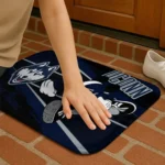 customized-uconn-huskies-mickey-quarterback-blue-black-doormat-best-selling.webp