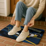 customized-west-virginia-mountaineers-mickey-quarterback-blue-black-doormat-best-selling.webp