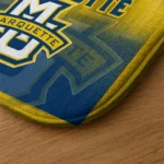 marquette-golden-eagles-pixel-blur-blue-doormat-best-selling.webp