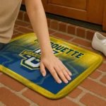 marquette-golden-eagles-pixel-blur-blue-doormat-best-selling.webp