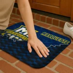 marquette-golden-eagles-tribal-detailing-blue-black-doormat-best-selling.webp