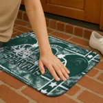 michigan-state-spartans-helmet-illustration-green-doormat-best-selling.webp