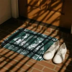 michigan-state-spartans-helmet-illustration-green-doormat-best-selling.webp