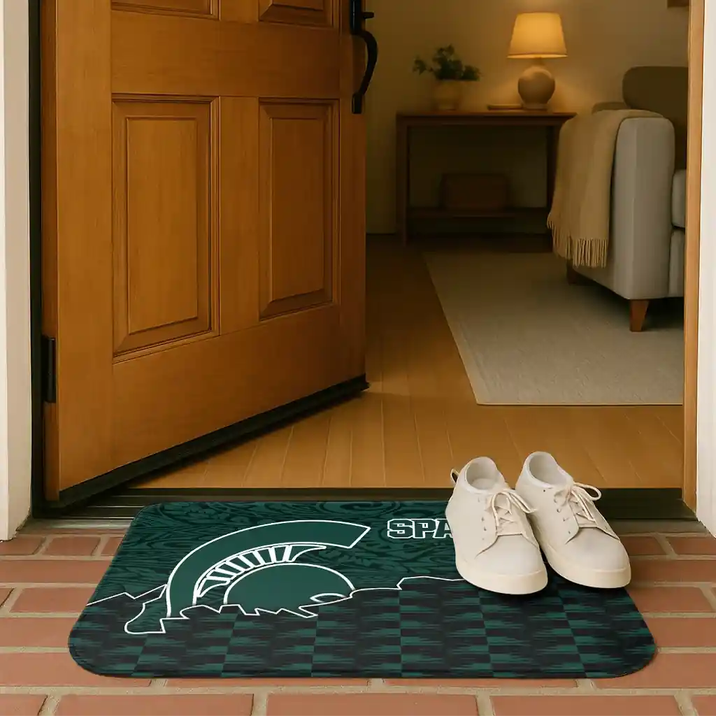 michigan-state-spartans-tribal-detailing-green-black-doormat-fashion-forward.webp