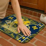 michigan-wolverines-helmet-illustration-blue-doormat-best-selling.webp