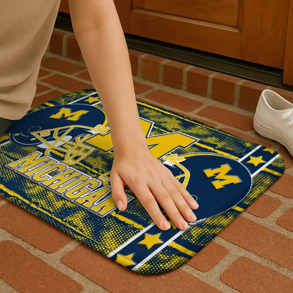 michigan-wolverines-helmet-illustration-blue-doormat-premium-grade.webp