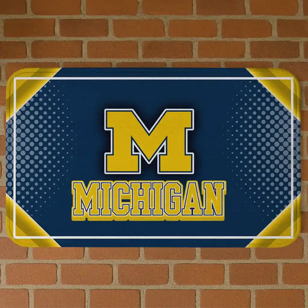 michigan-wolverines-silver-halftone-blue-doormat-best-selling.webp michigan wolverines silver halftone blue doormat best selling