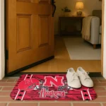 nebraska-cornhuskers-helmet-illustration-red-doormat-best-selling.webp