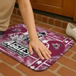 new-mexico-state-aggies-helmet-illustration-crimson-doormat-best-selling.webp