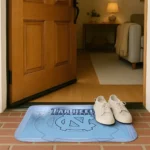 north-carolina-tar-heels-pixel-blur-light-blue-doormat-best-selling.webp