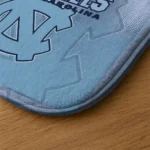 north-carolina-tar-heels-pixel-blur-light-blue-doormat-best-selling.webp