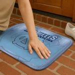 north-carolina-tar-heels-pixel-blur-light-blue-doormat-best-selling.webp