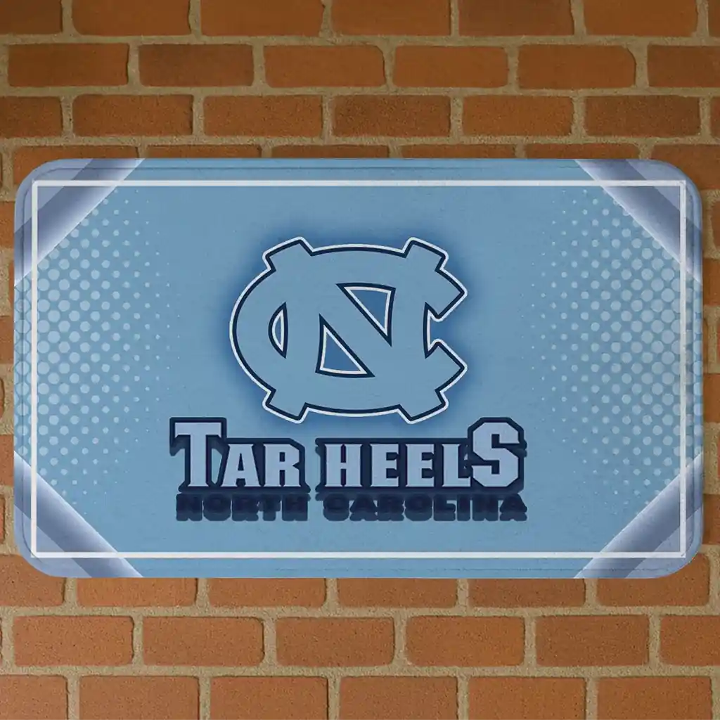north-carolina-tar-heels-silver-halftone-light-blue-doormat-best-selling.webp north carolina tar heels silver halftone light blue doormat best selling