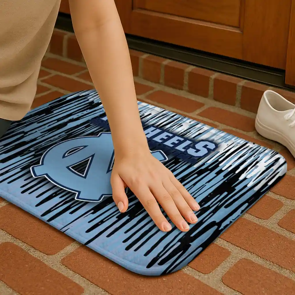 north-carolina-tar-heels-vertical-flow-light-blue-doormat-premium-grade.webp